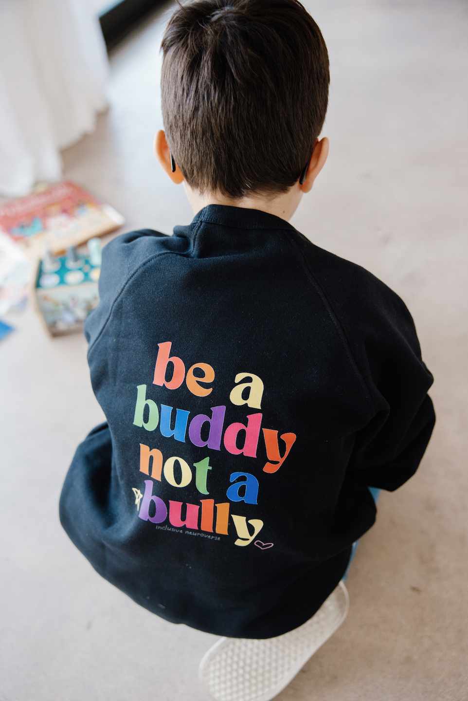 Be a Buddy, Not a Bully t-shirt advocating for kindness and mental health awareness.